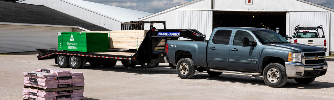 2019 Sure-Trac Heavy Duty Deckover with Hydraulic Beavertail parked on a lot